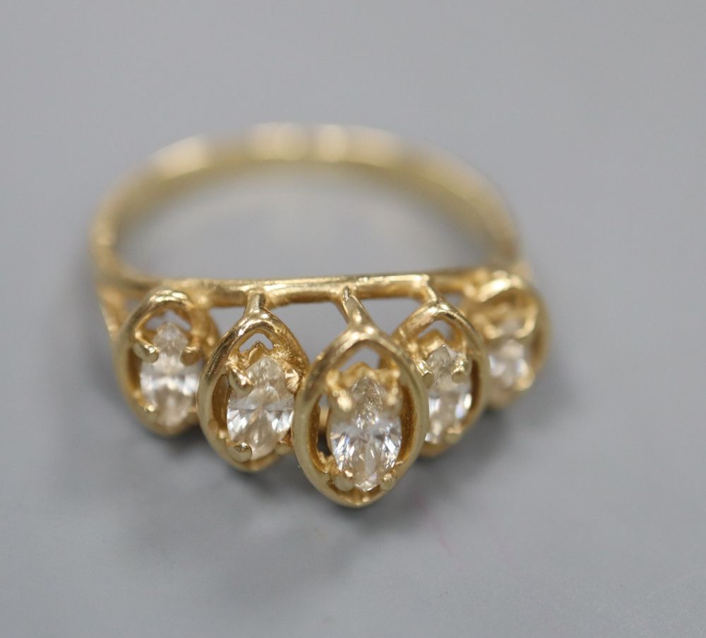 A modern 14k and graduated five stone marquise cut diamond half hoop ring, size M/N, gross 2.8 grams.